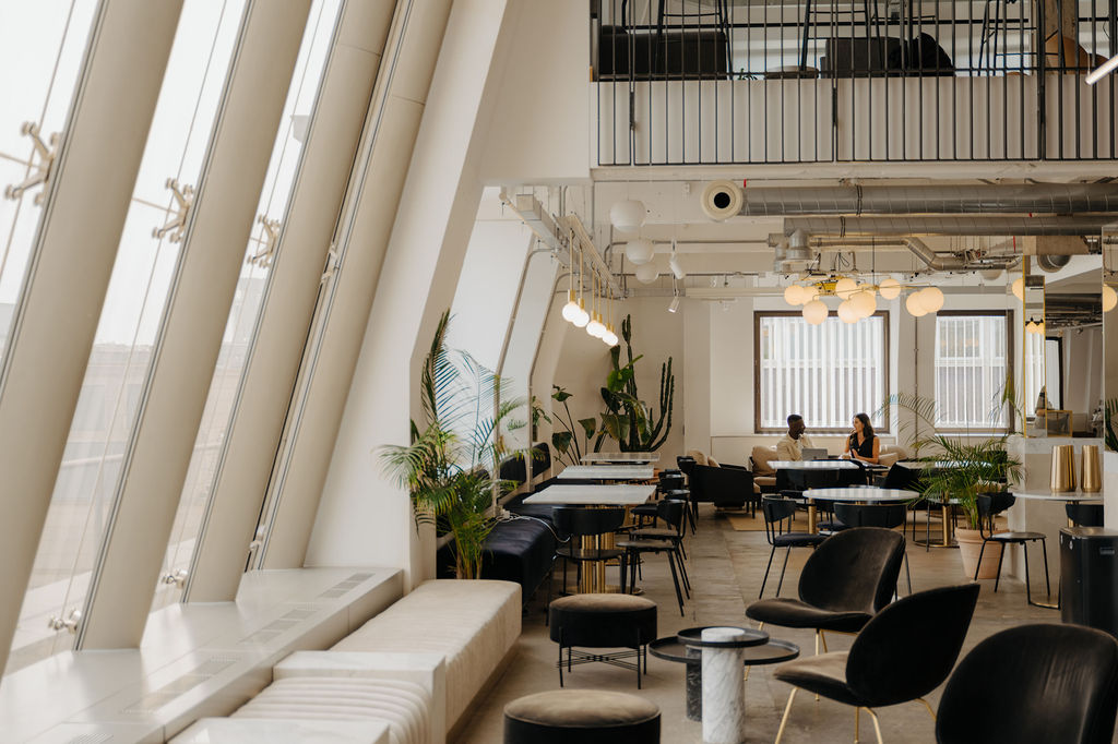 Modern hot desk workspace with ergonomic chair and natural lighting