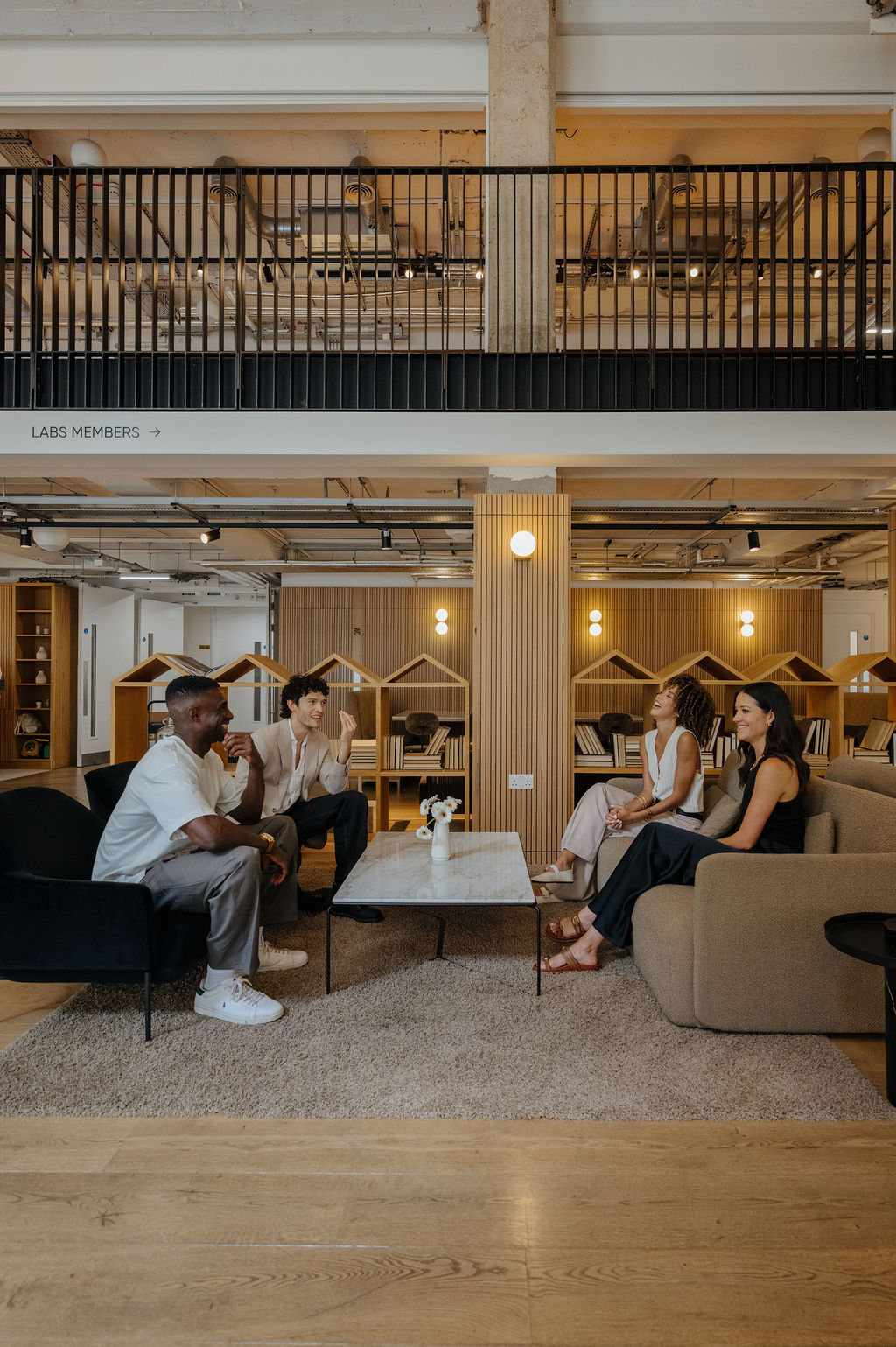Team collaborating in modern coworking space with comfortable seating