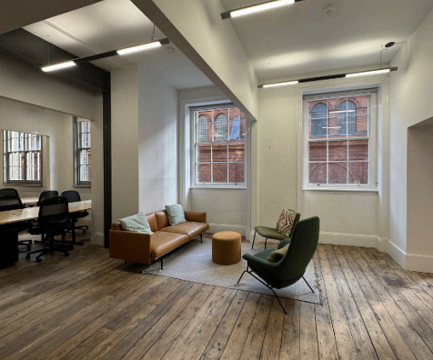 365 Finance breakout room with leather sofa