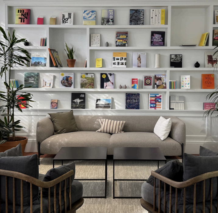 365 Finance office lounge area with bookshelves
