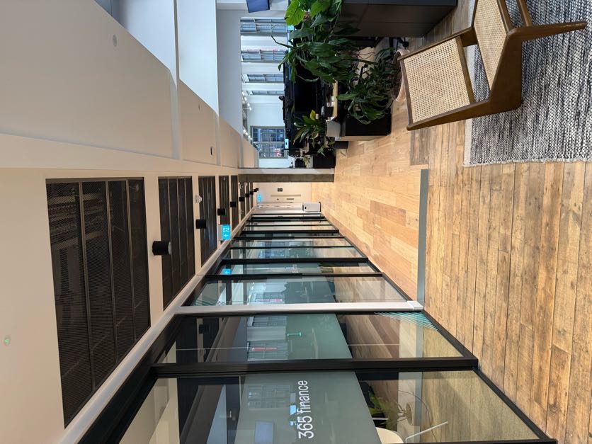 365 Finance office corridor with glass meeting rooms