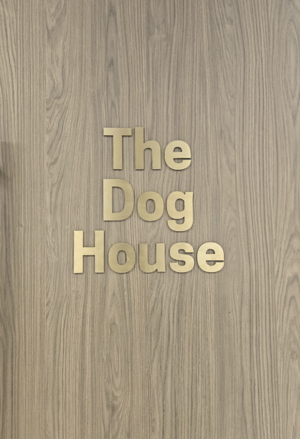 The Dog House wooden wall sign with branded lettering in Butternut Box office