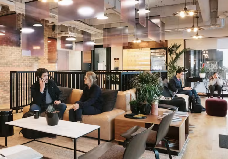 Modern flexible office space with teams working in various collaborative settings